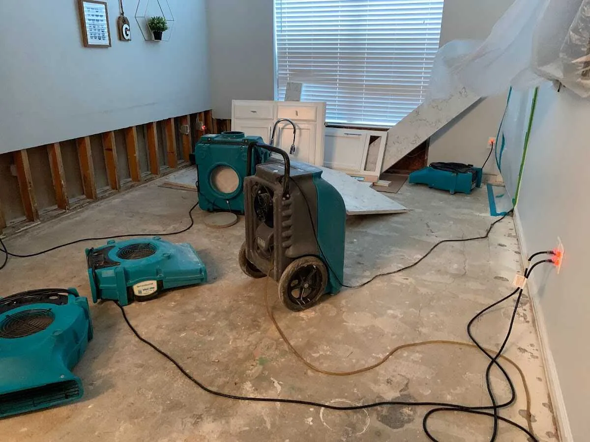 Dehumidifier in flood-cut room for Water Damage Restoration in Garner